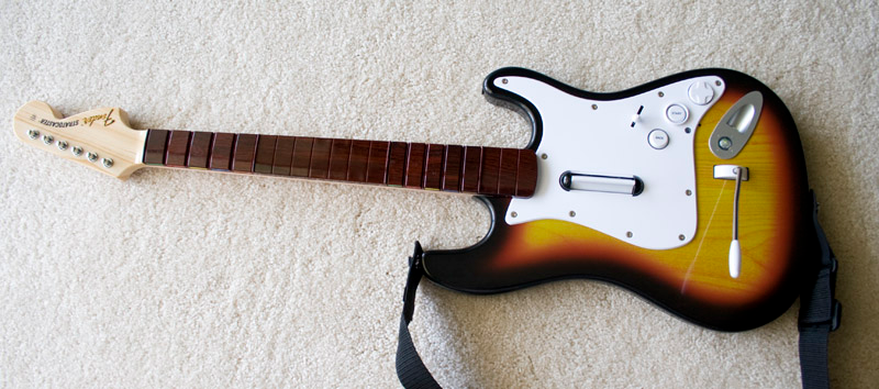 Illustration for article titled Rock Band 2 Wireless Guitar and Drums Hardware Review